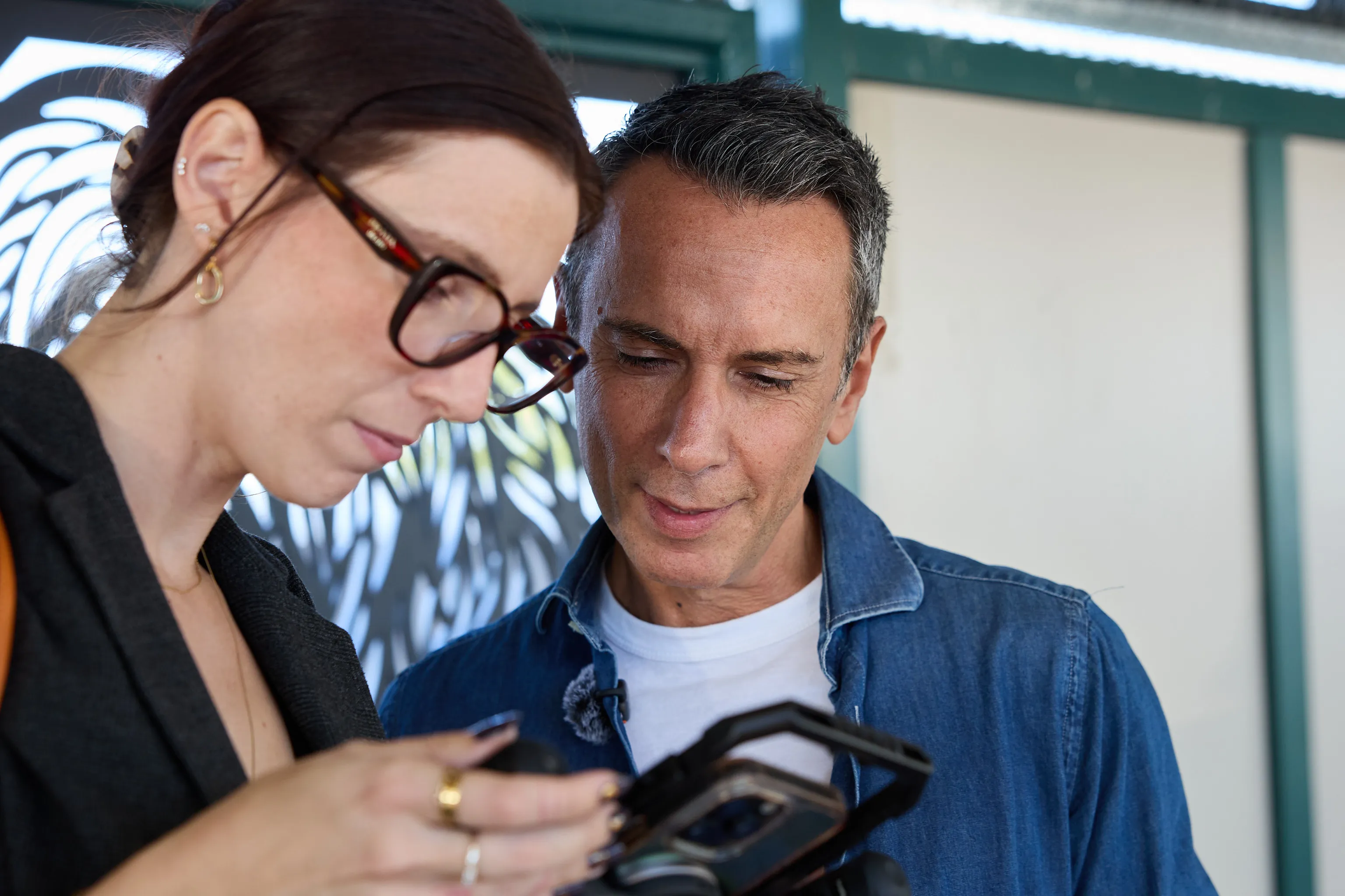 Reviewing footage on a monitor with a client during a shoot